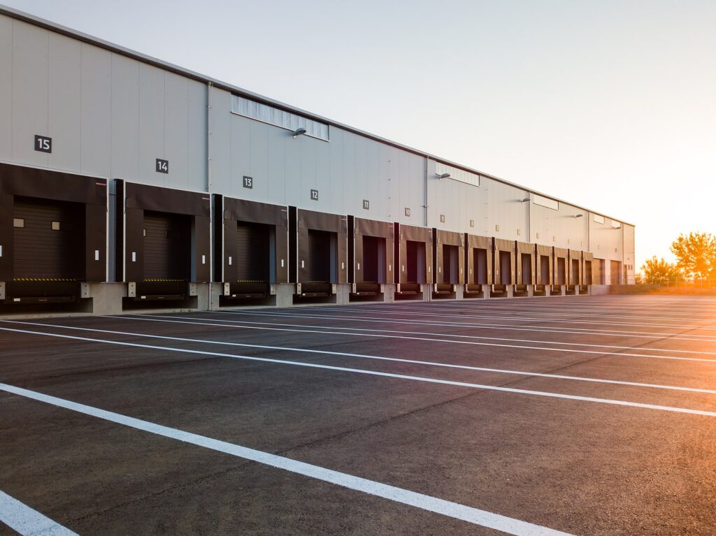 Outside of a warehouse with loading docks for storage trailers