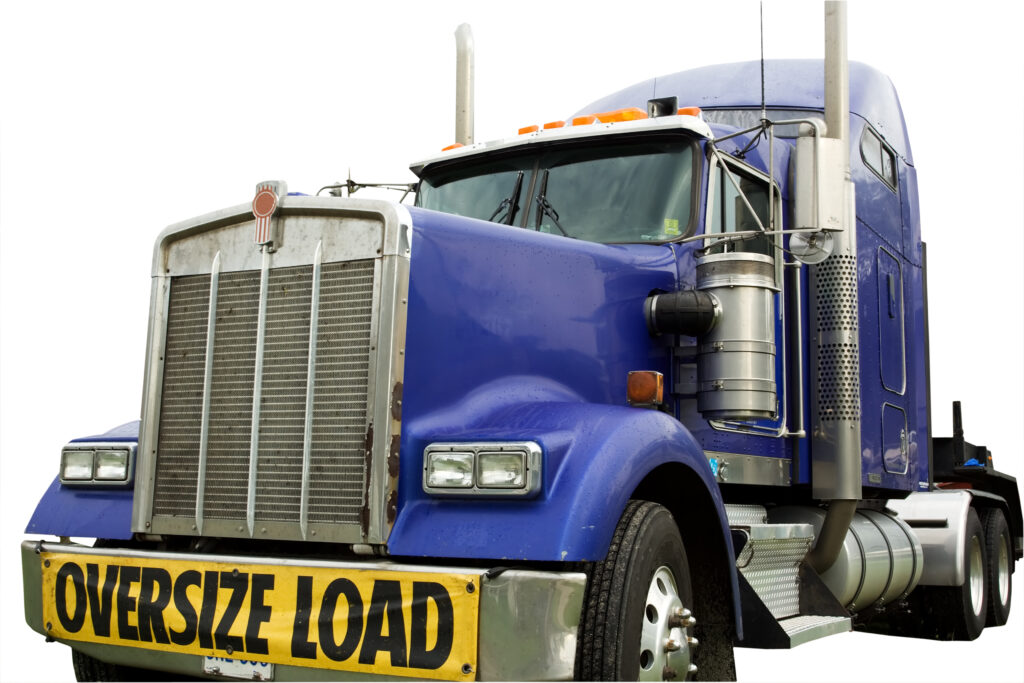A truck cab reading "oversize load"