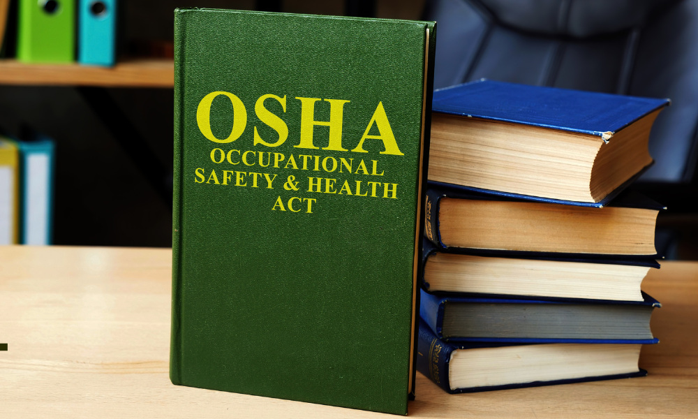 OSHA on the cover of a book on a desk