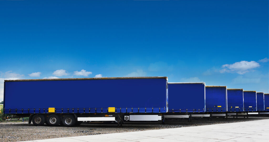 Truck semi trailers waiting to be unloaded at a warehouse